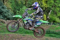 Motocross Rider in Action: Soaring Through the Dirt