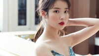 Elegant and captivating portrait of IU, showcasing her beauty and style in a striking outfit.