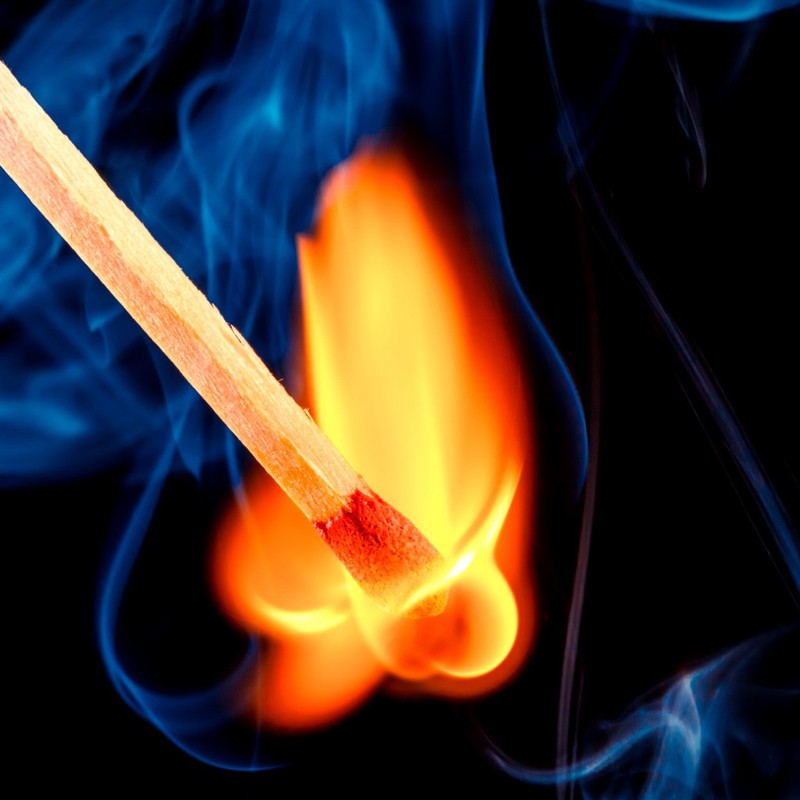 A close up of a matchstick with a flame in the background (emoticon, firechuck, happy, hd, horrible)