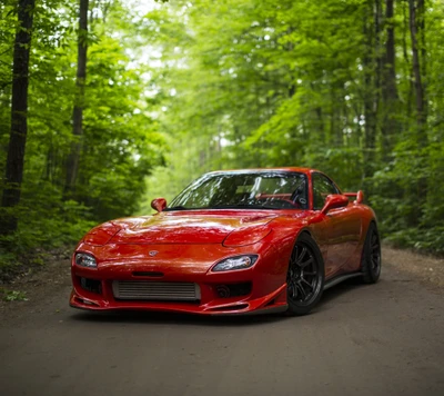 Red Mazda RX-7 Amidst Lush Green Trees in Japan