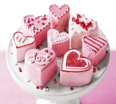 Heart-Shaped Cookies Decorated with Pink Icing and Sprinkles