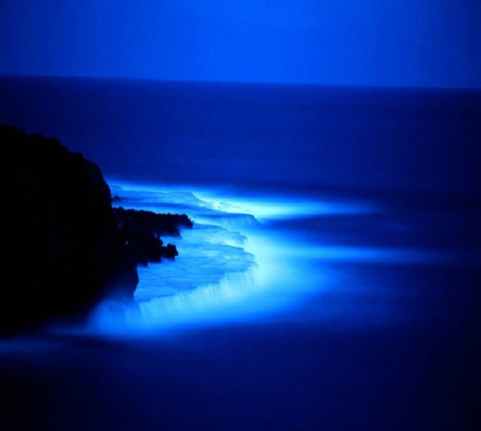 Arafed view of a body of water with a light shining on it (nature)