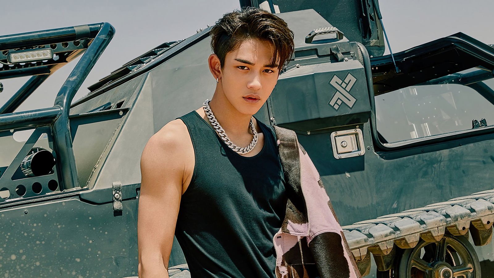 Arafed man in black tank top standing next to a tank (lucas, 루카스, hwang wook hee, 황욱희, huang xuxi)