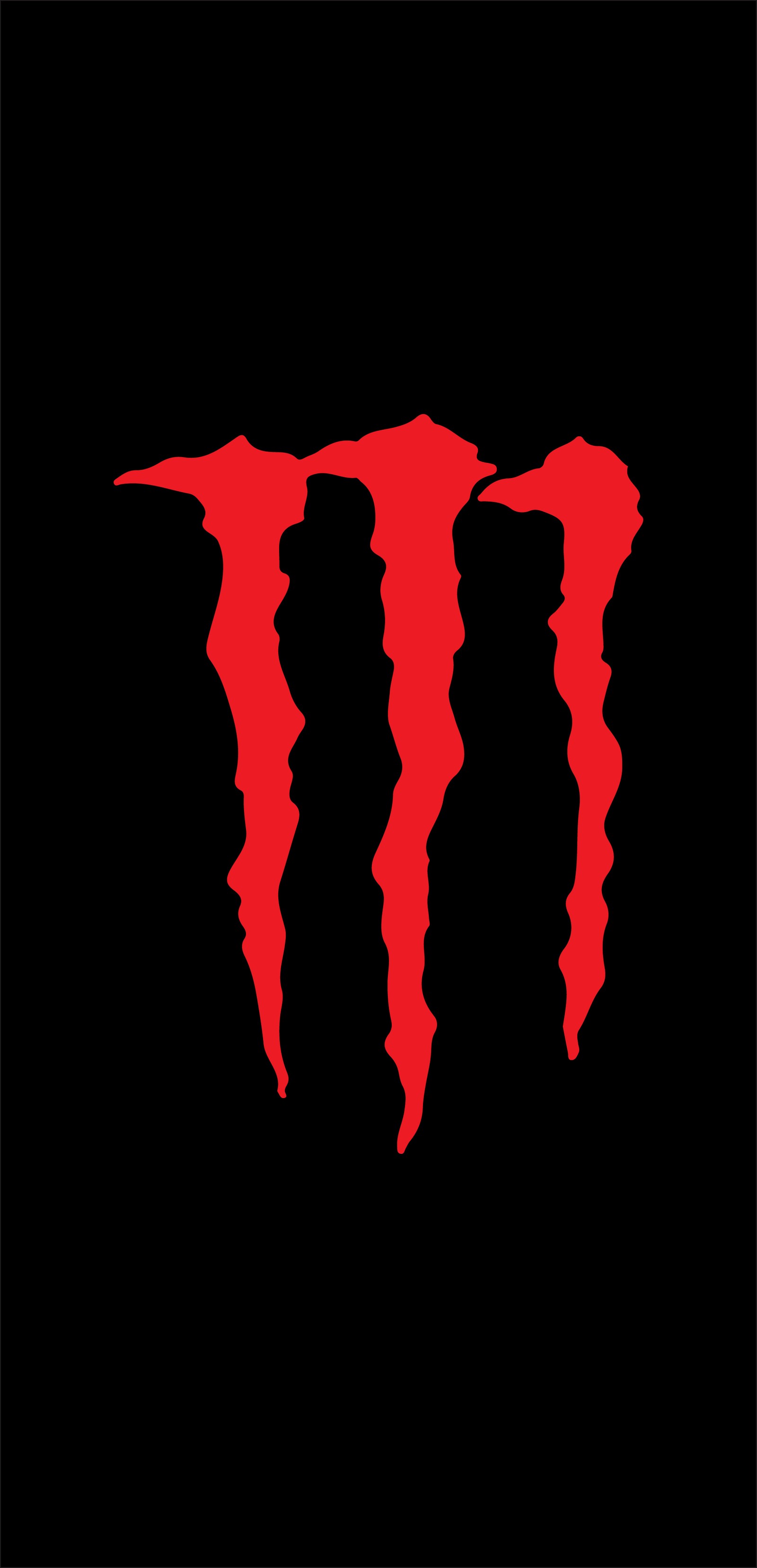 Un gros plan du logo rouge de monster sur un fond noir (boisson, noir, energizante, énergie, logo)