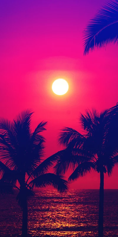 Atardecer vibrante sobre la playa con palmeras en silueta