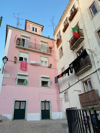 Charming Pink Apartment Facade in a Quaint Neighbourhood