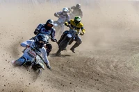 Thrilling Freestyle Motocross Action on a Dusty Race Track