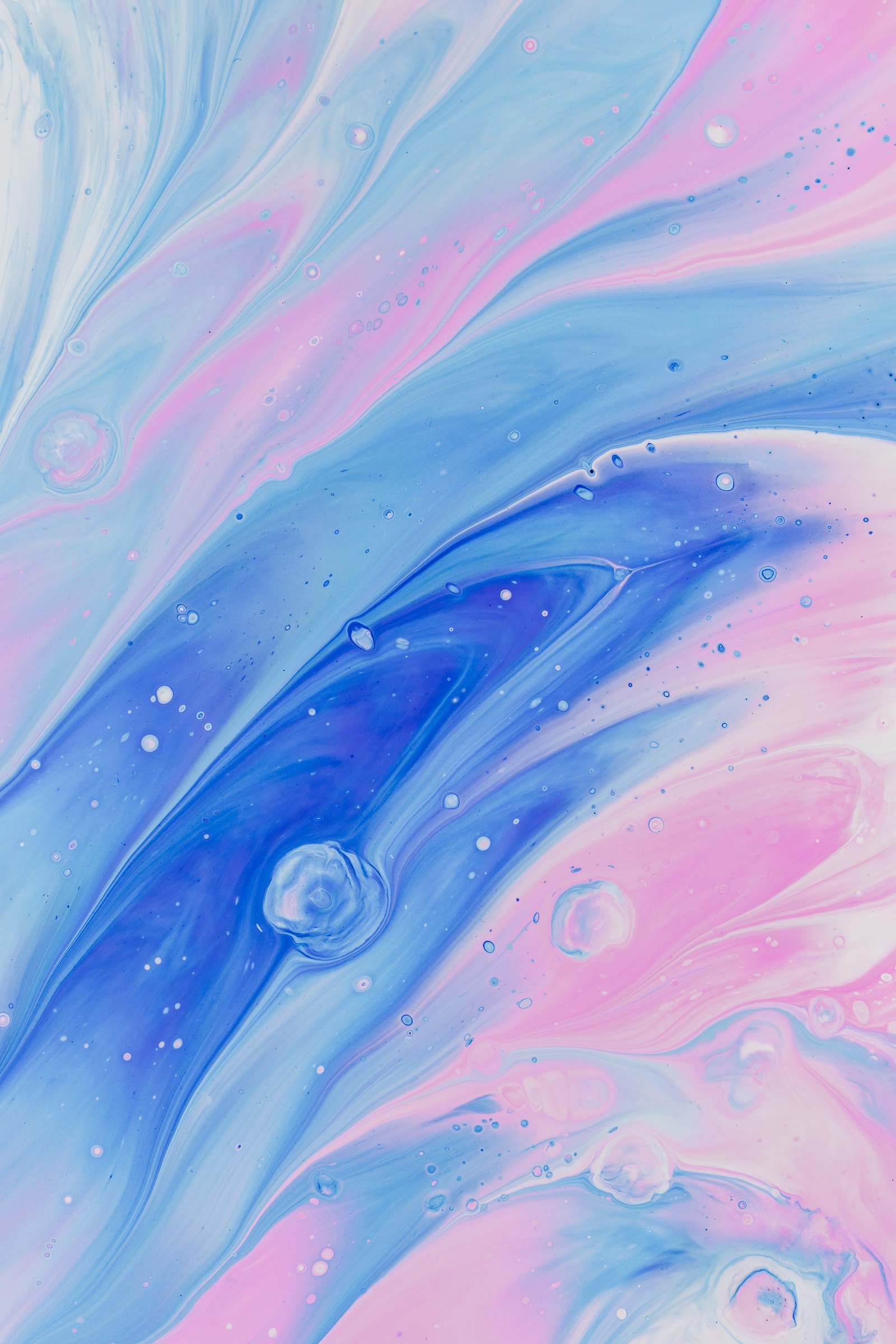 A close up of a painting of a blue and pink swirl (blue, water, watercolor paint, aqua, acrylic paint)