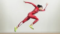 Dynamic Athlete in Mid-Sprint, Showcasing Power and Precision in Nike Gear