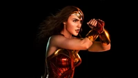 Wonder Woman poised for action in a powerful, dynamic pose, embodying strength and beauty against a dark backdrop.