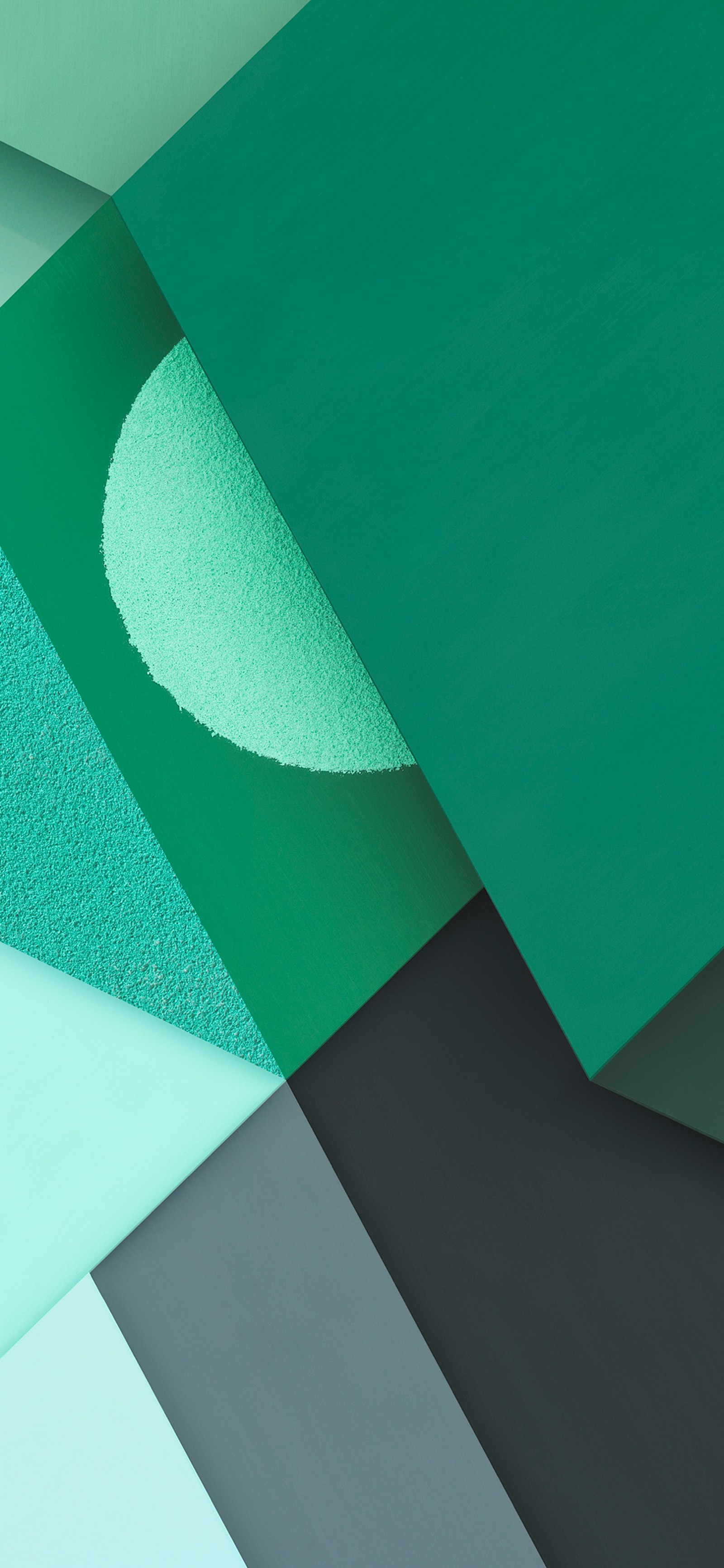 A close up of a green and blue wall with a white circle (rectangle, triangle, aqua, magenta, art)