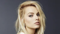 Margot Robbie: Stunning Blonde Actress Captured in a Striking Portrait