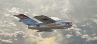 Nordkoreanisches Mikoyan-Gurevich MiG-15 Jagdflugzeug im Flug zwischen Wolken