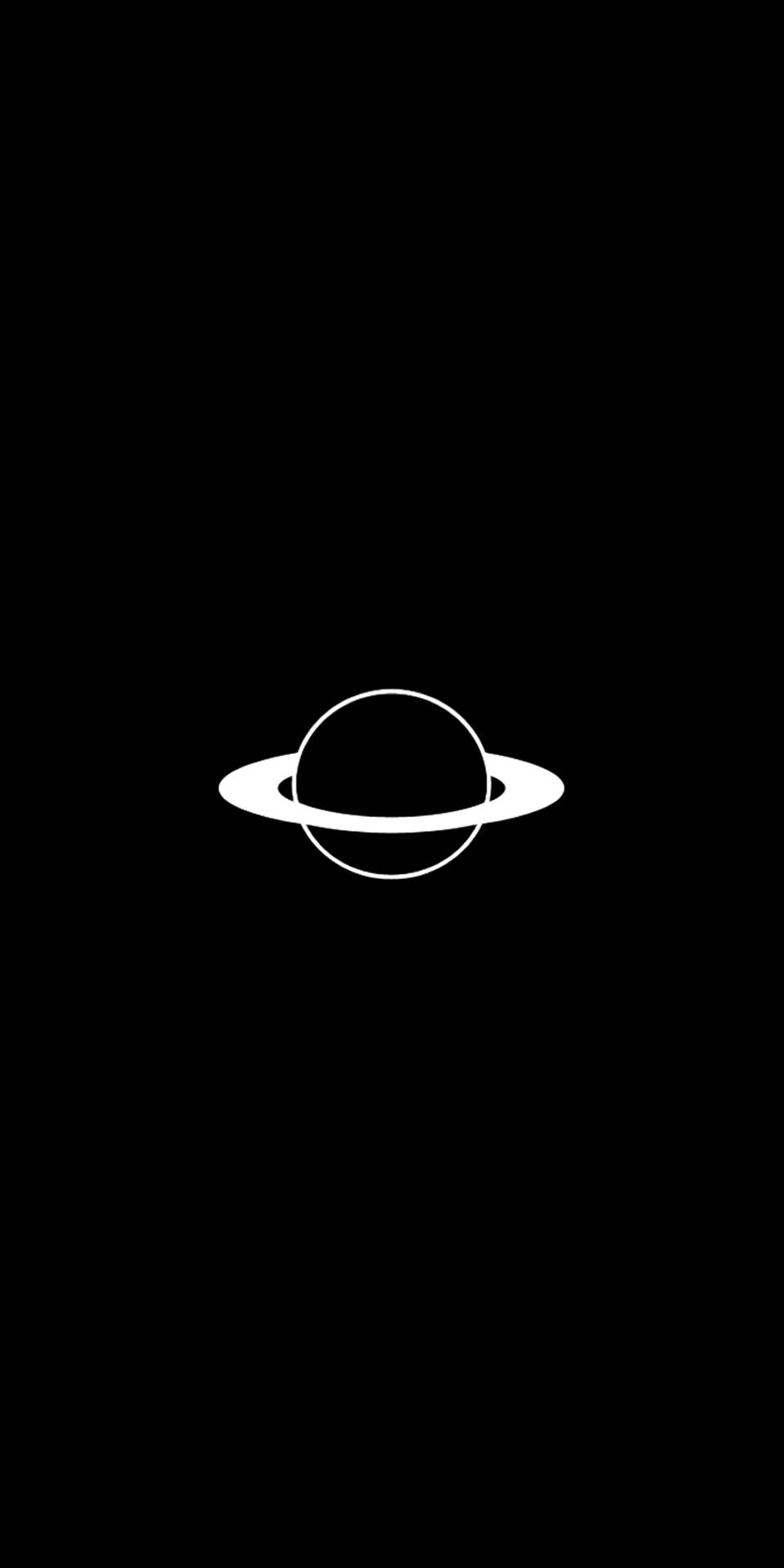 A close up of a black and white photo of a saturn (black, galaxy, planet, space, white)