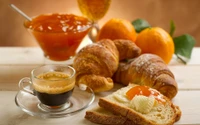 Delicioso desayuno vegetariano con croissants, mermelada fresca y espresso