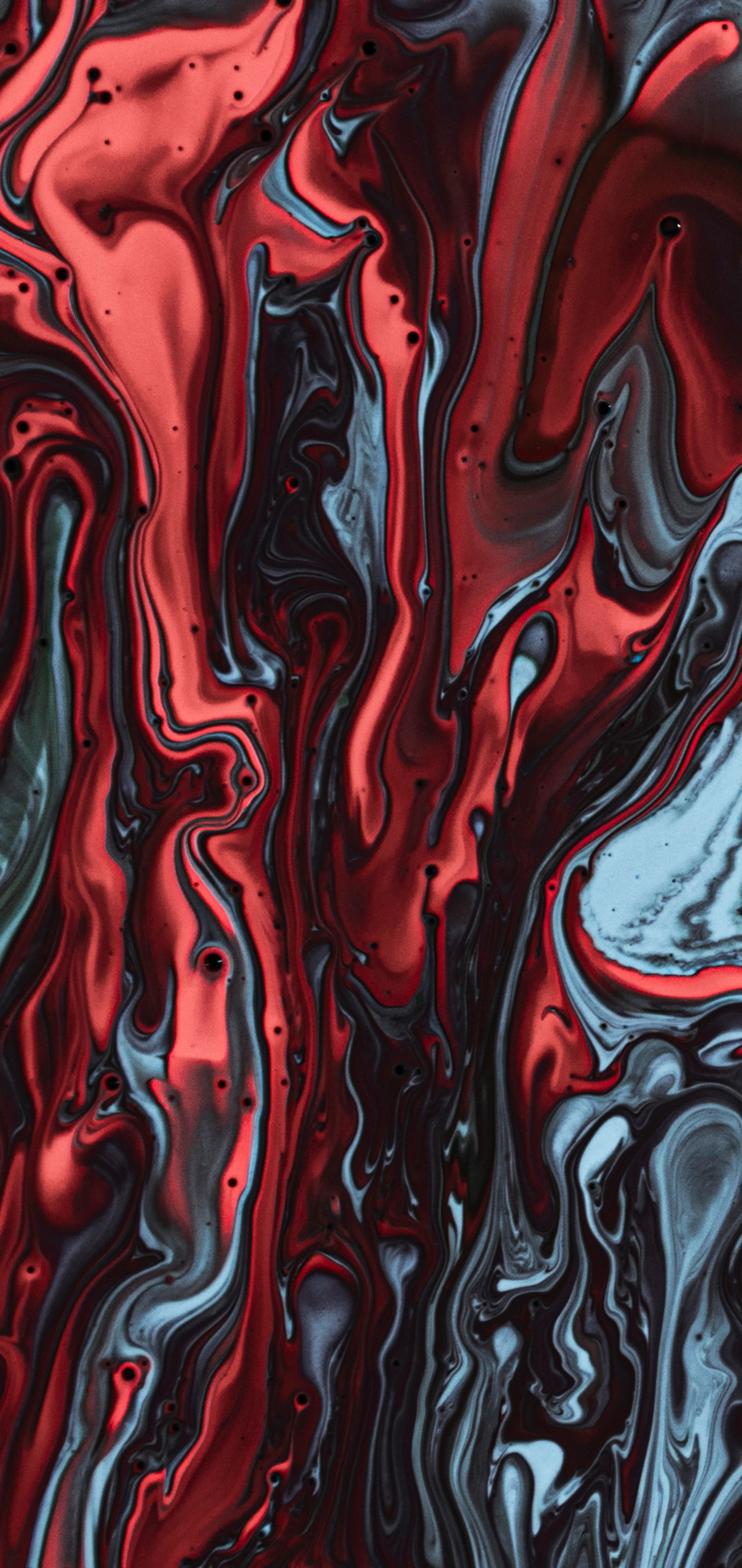 A close up of a red and black liquid painting on a surface (textile, liquid, art, red, magenta)