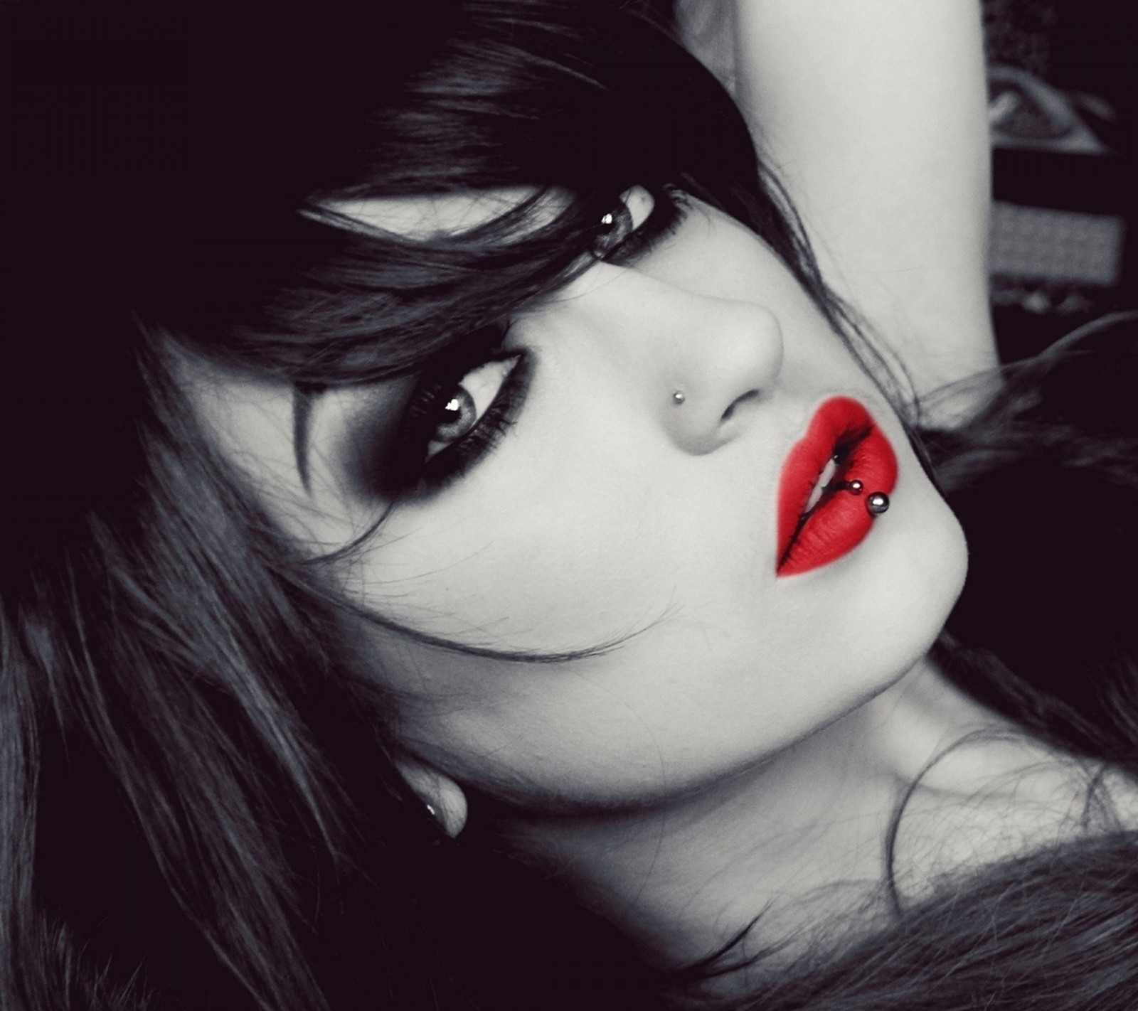 Arafed woman with red lips and black hair with piercings (beauty, black, lips, red, sensual)