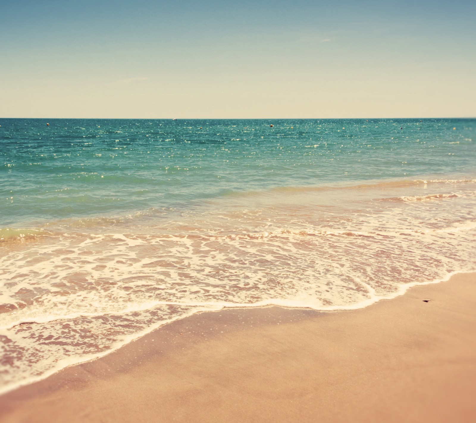 There is a view of a beach with a wave coming in (sea, shore, summer, water)