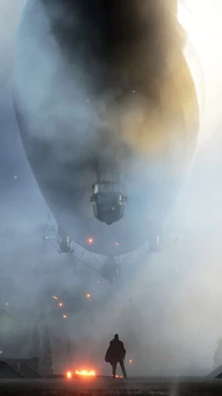 A lone soldier stands under the looming silhouette of a massive airship amidst a smoky battlefield, illuminated by distant explosions.