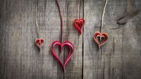 Handcrafted Red Heart Ornaments on Rustic Wood