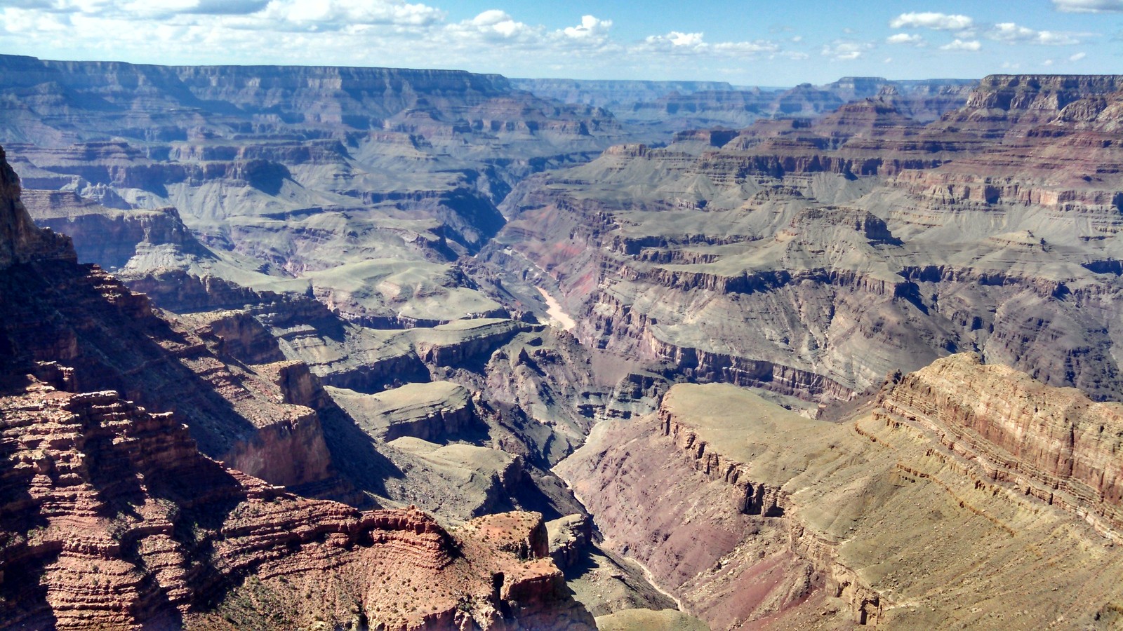 Araffe view of a canyon with a steep cliff and a blue sky (grand canyon, bryce canyon national park, antelope canyon, national park, canyon)