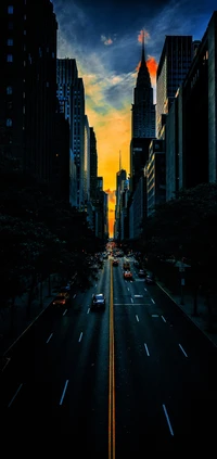 Skyscraper Silhouette at Sunset with Illuminated Road