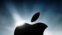 Silhouette du logo Apple avec un fond de lumière radiante