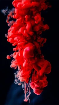 Red Smoke Explosion on a Black Background