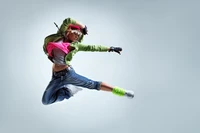 Dynamic street dancer executing an impressive leap, showcasing energy and style in vibrant modern attire.