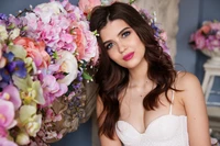 Elegant Portrait of a Beautiful Girl Amongst a Floral Bouquet