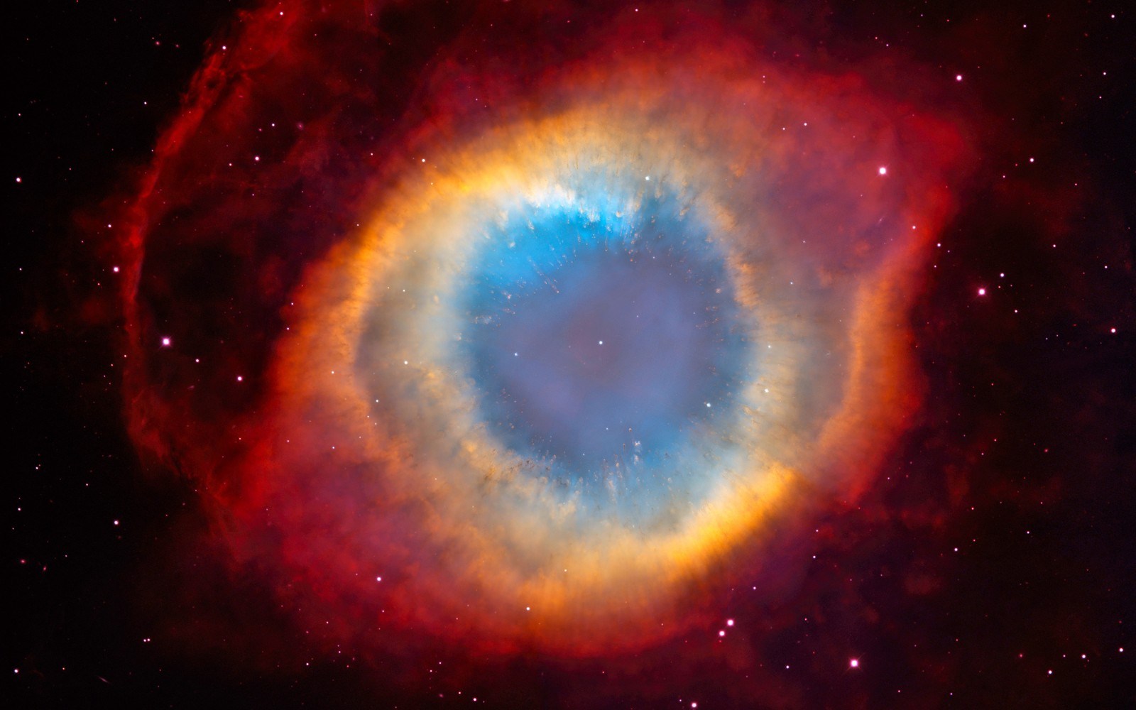 Nahaufnahme eines planetarischen objekts mit einem leuchtend blauen ring (helix nebel, nebel, hubble weltraumteleskop, astronomie, astronomisches objekt)