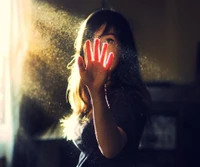 Girl with Outstretched Hand in Sunlit Dust