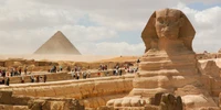 The Great Sphinx of Giza stands majestically in front of the Great Pyramid, a symbol of ancient Egyptian history and a UNESCO World Heritage site, attracting visitors from around the world.