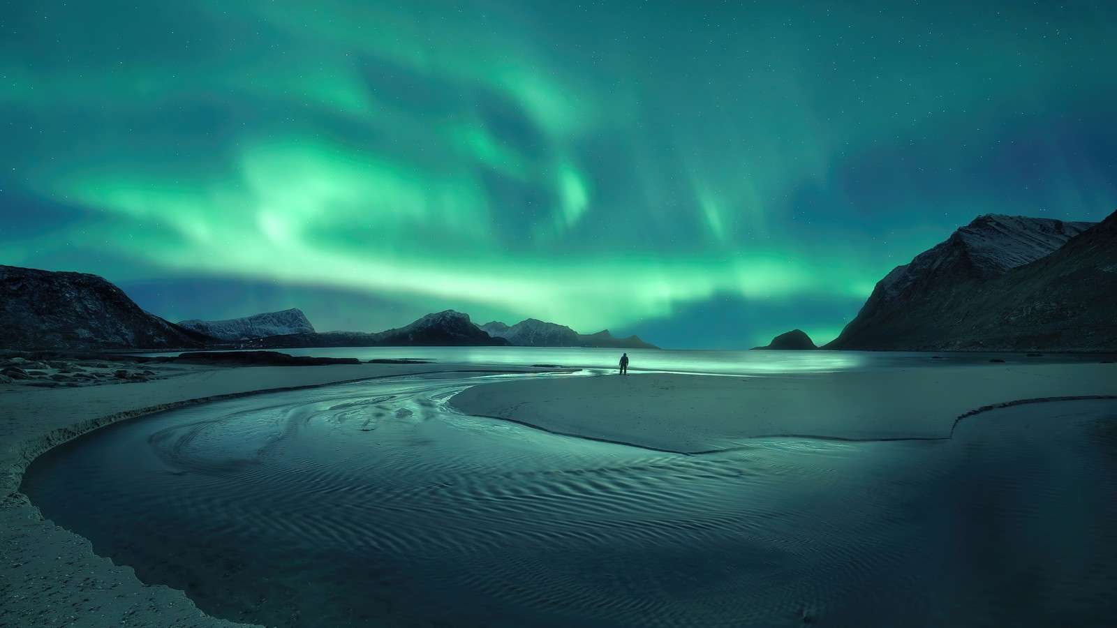 A person standing on a beach under the aurora lights (aurora borealis, northern lights, landscape, scenery, photography)