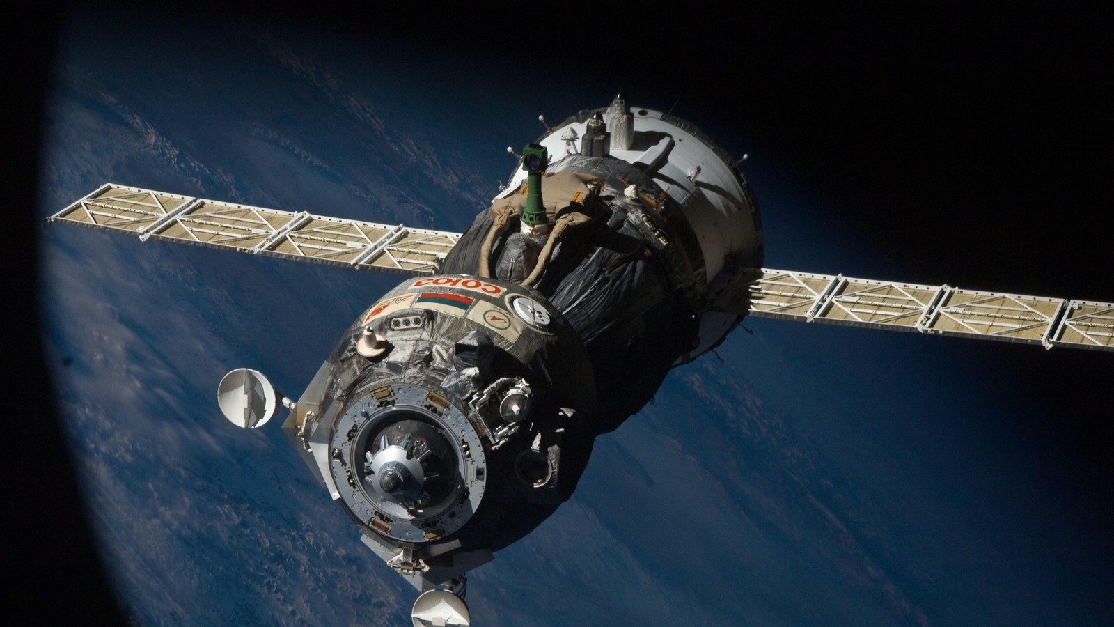 A close up of a space station with a satellite in the background (spacecraft, international space station, outer space, astronaut, space station)