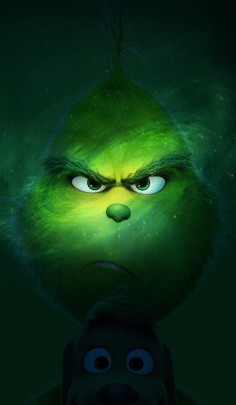 Крупный план зеленого лица на зеленом фоне (злой, гринч, grinch)