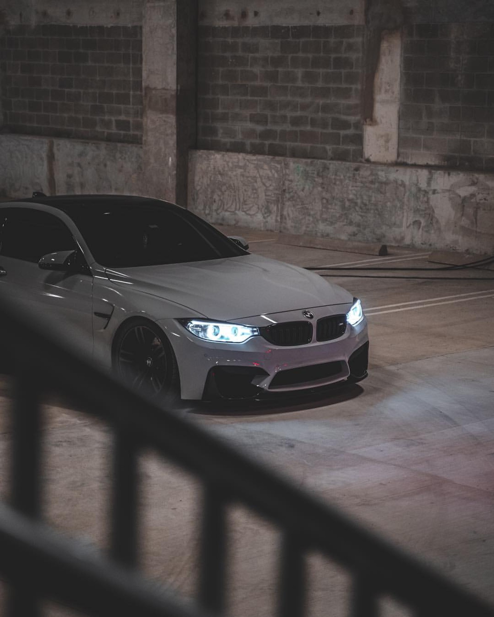 A close up of a car parked in a parking garage (bmw, m4, f82, coupe, tuning)