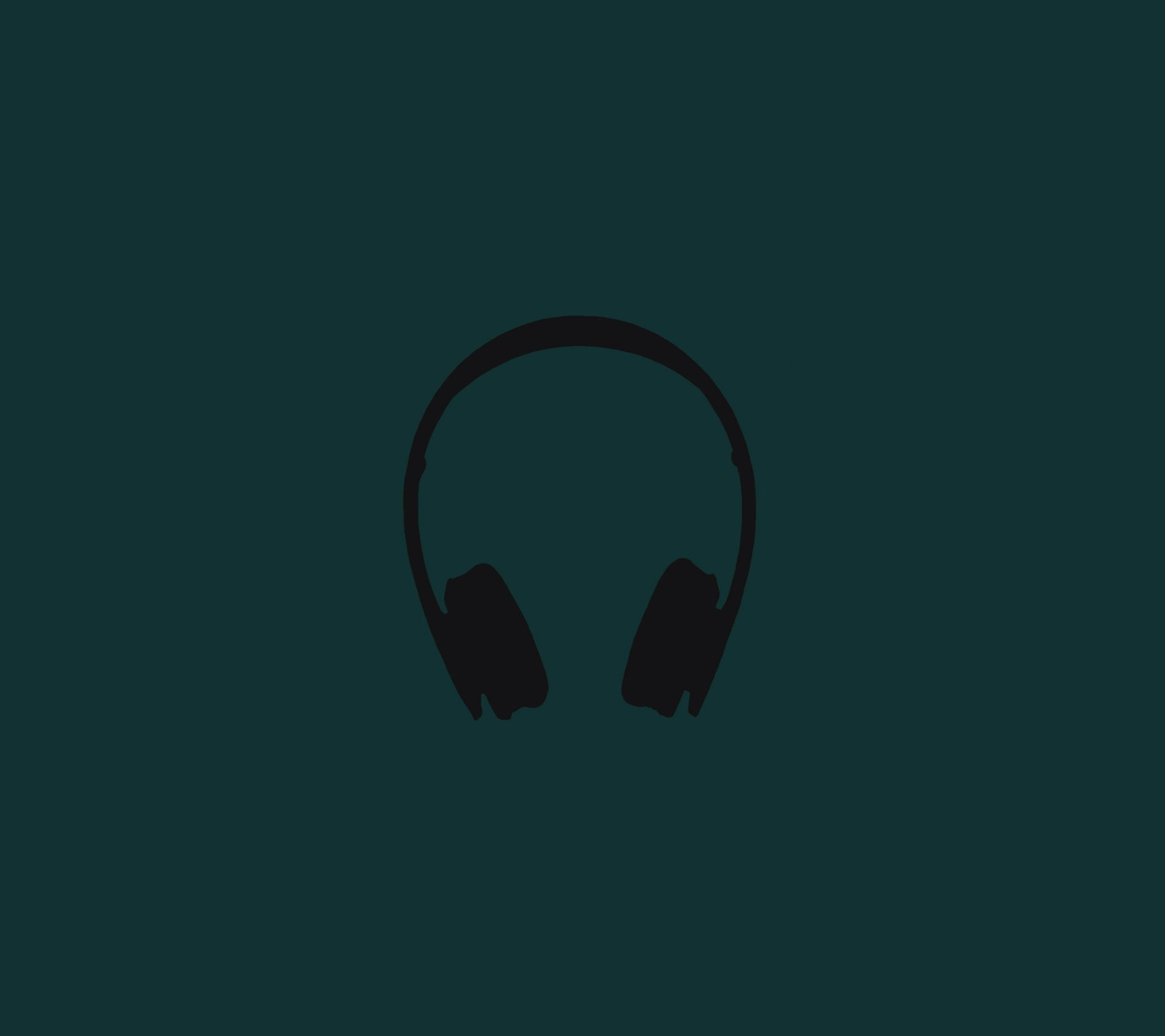 A close up of a pair of headphones on a dark background (beats, headphones, minimal)