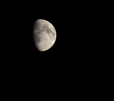 Waxing Crescent Moon Against a Starlit Sky