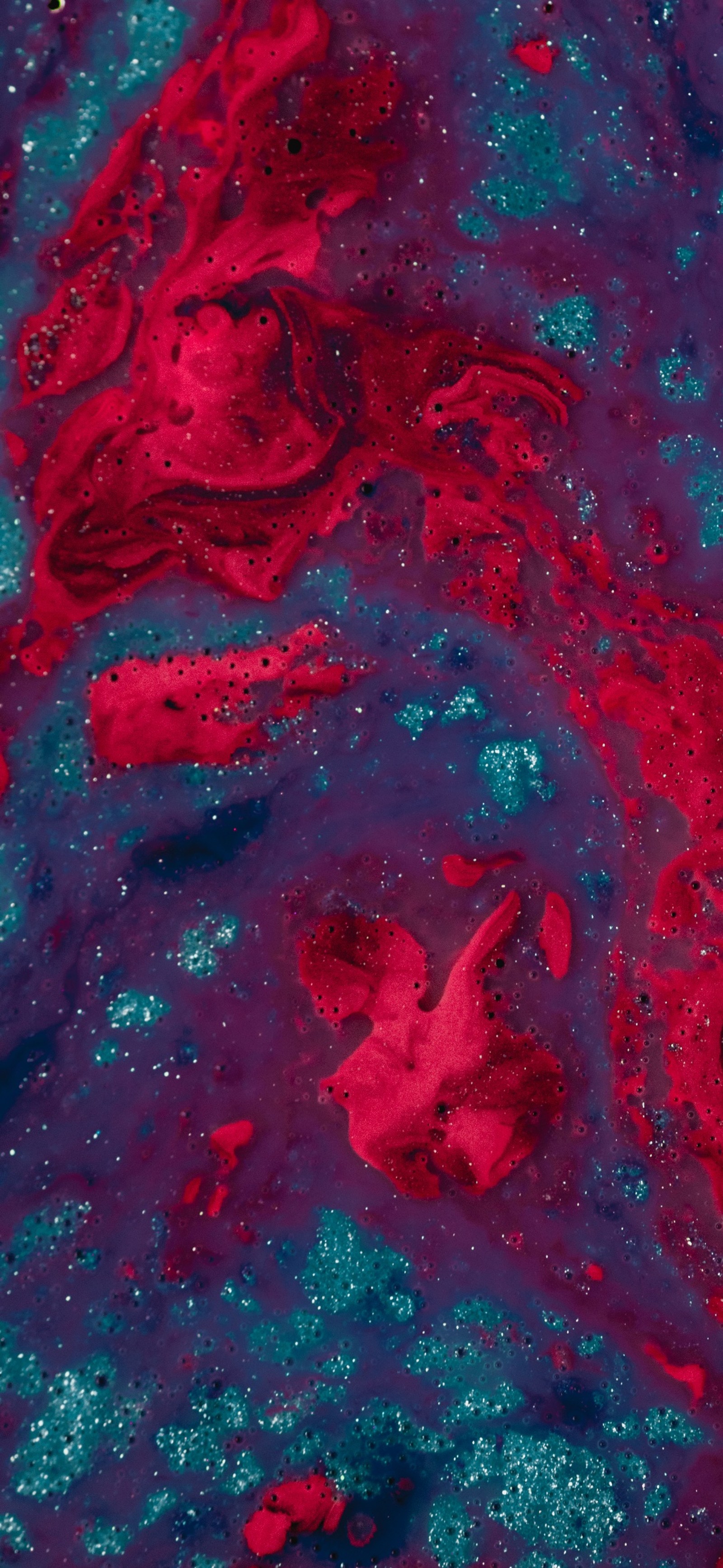 A close up of a red and blue liquid substance on a surface (water, abstract art, painting, visual arts, liquid)