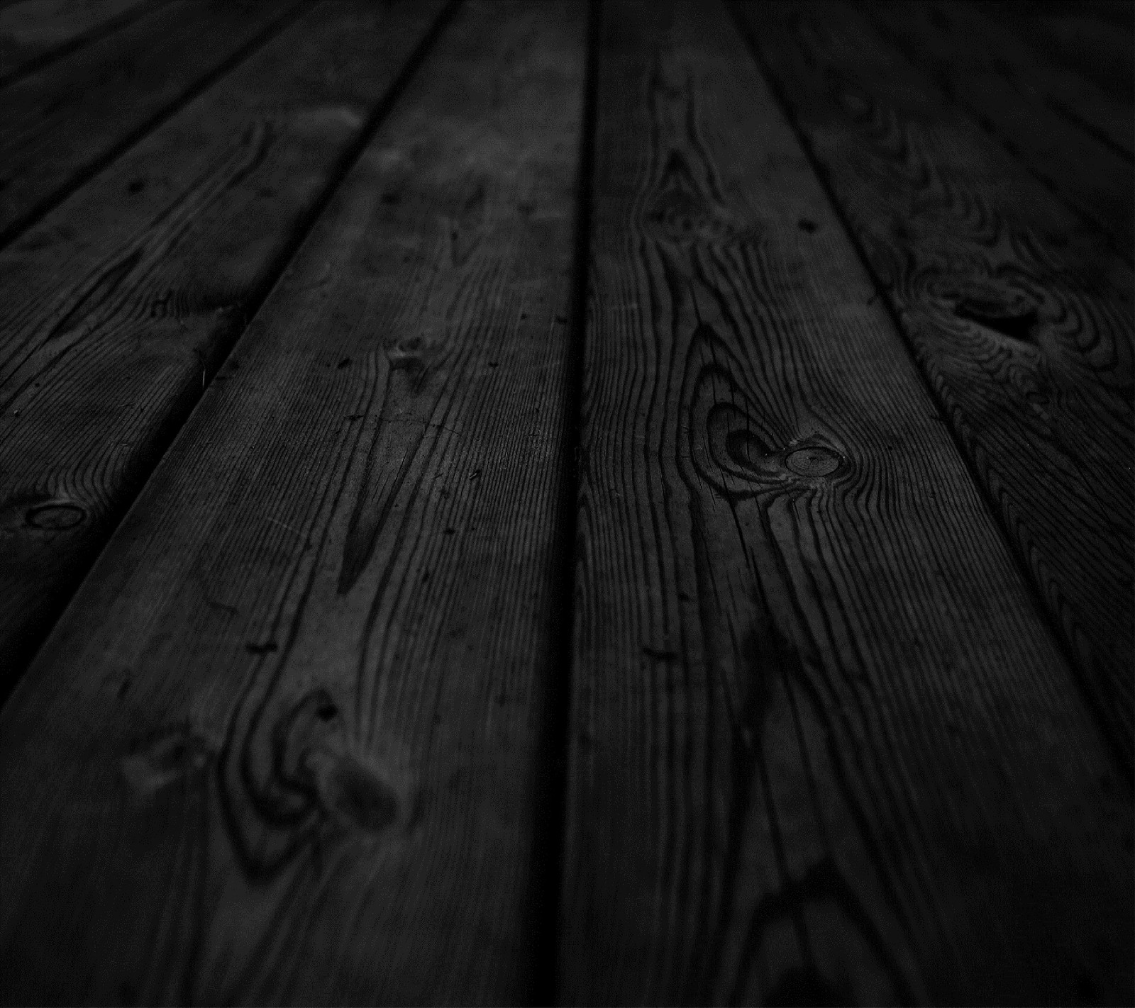 A close up of a wooden floor with a black background (amazing, black, cool, photography, stave)