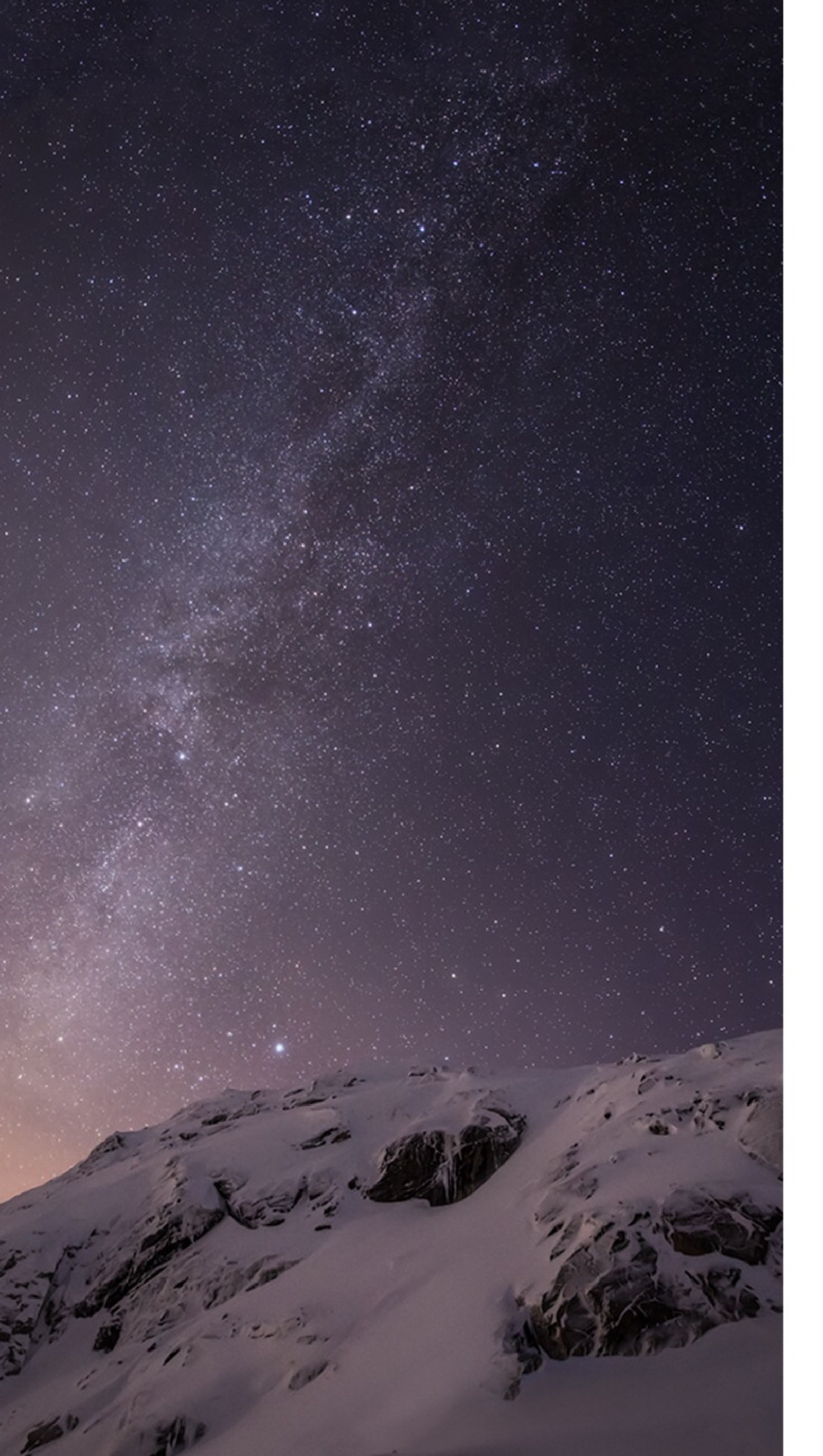 Starry sky over a snowy mountain with a lone person on a snowboard (ios 8, iphone 6, wallpapers)