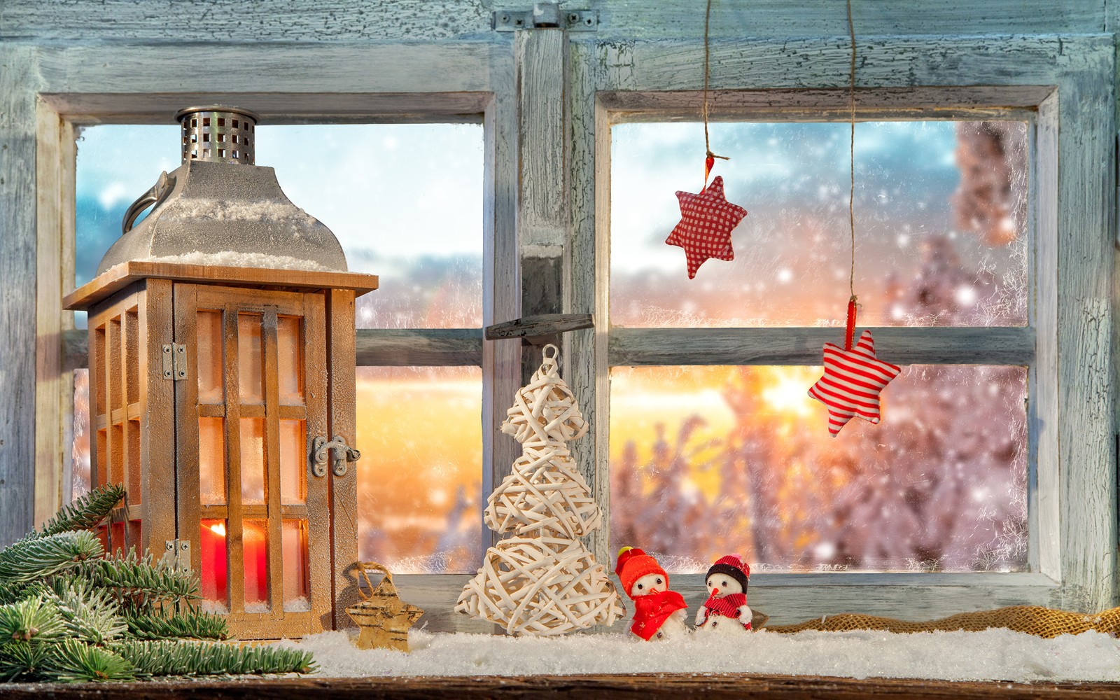 There is a small christmas tree and a lantern on a window sill (christmas day, window, lighting, winter, christmas decoration)