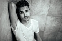 Monochrome Portrait of a Thoughtful Man in a Wet T-Shirt