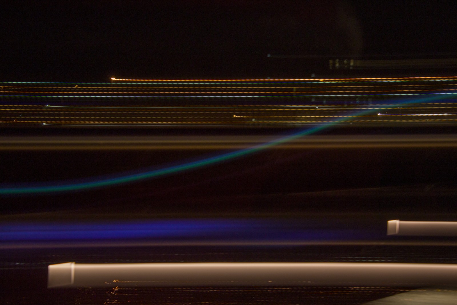 Arafed view of a city at night with a traffic light (light, abstraction, night, exposure, line)