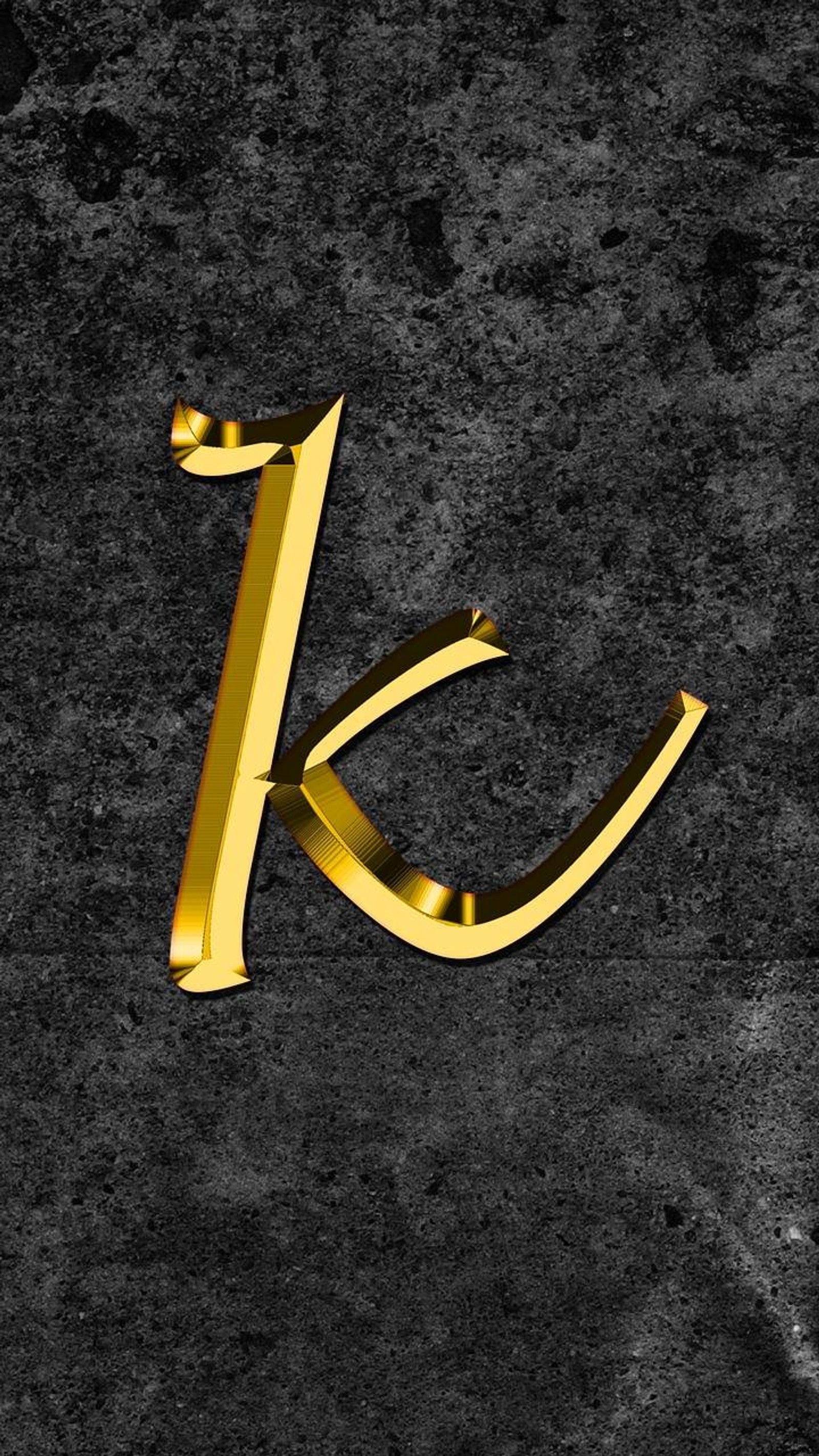 A close up of a gold letter k on a black background (k letter, letter)