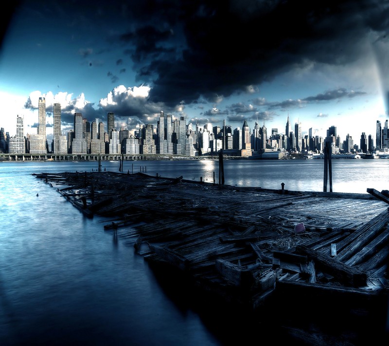 There is a picture of a city skyline with a dock in the foreground (city, wallpaper)