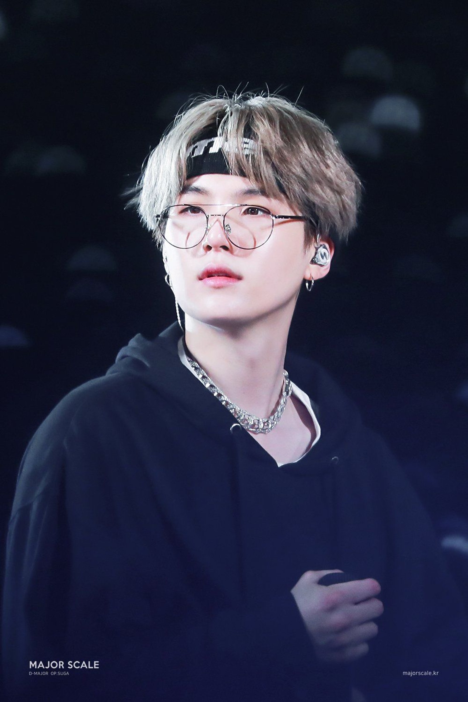 A close up of a person wearing glasses and a black hoodie (bts, min yoongi, suga)