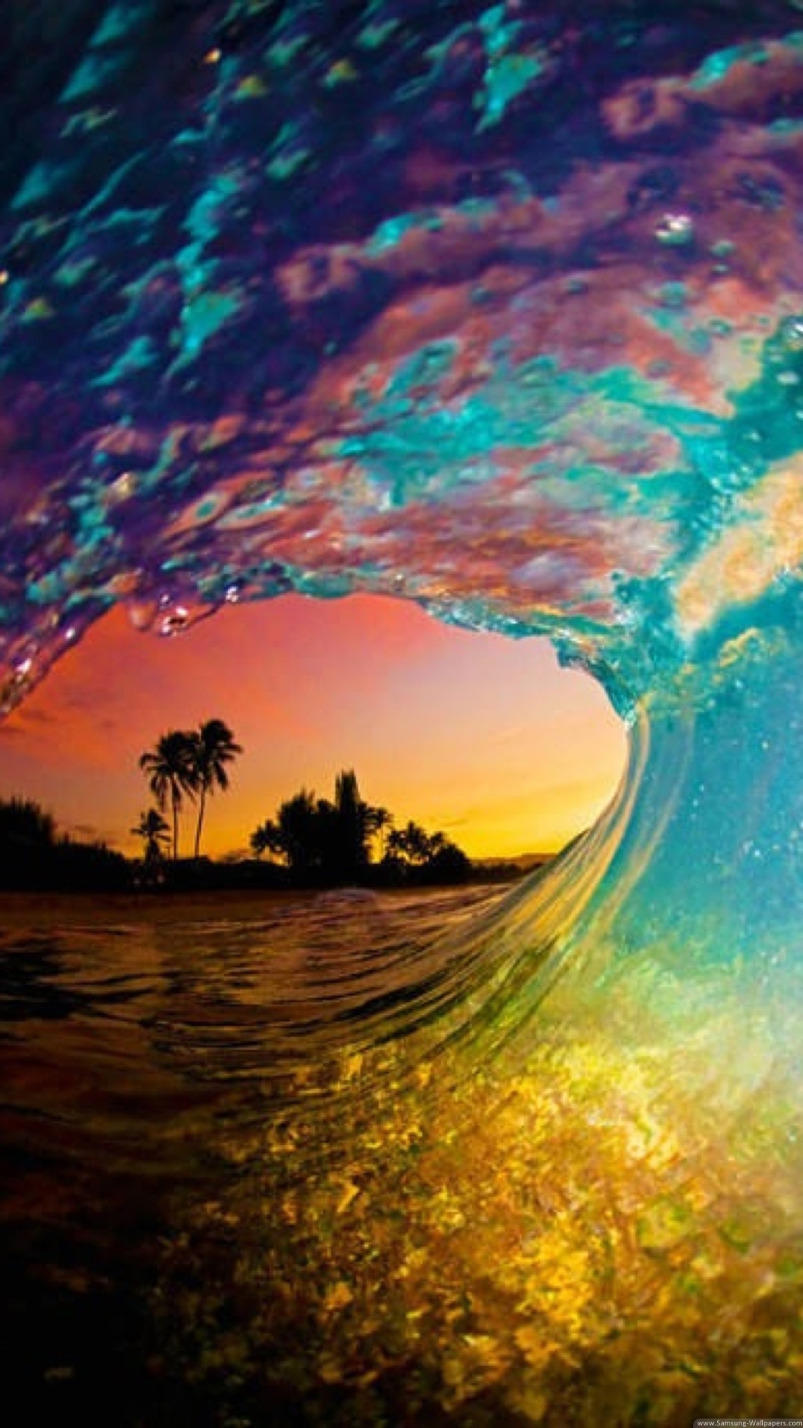 A close up of a wave with a sunset in the background (colores, ocean, sea, summer)