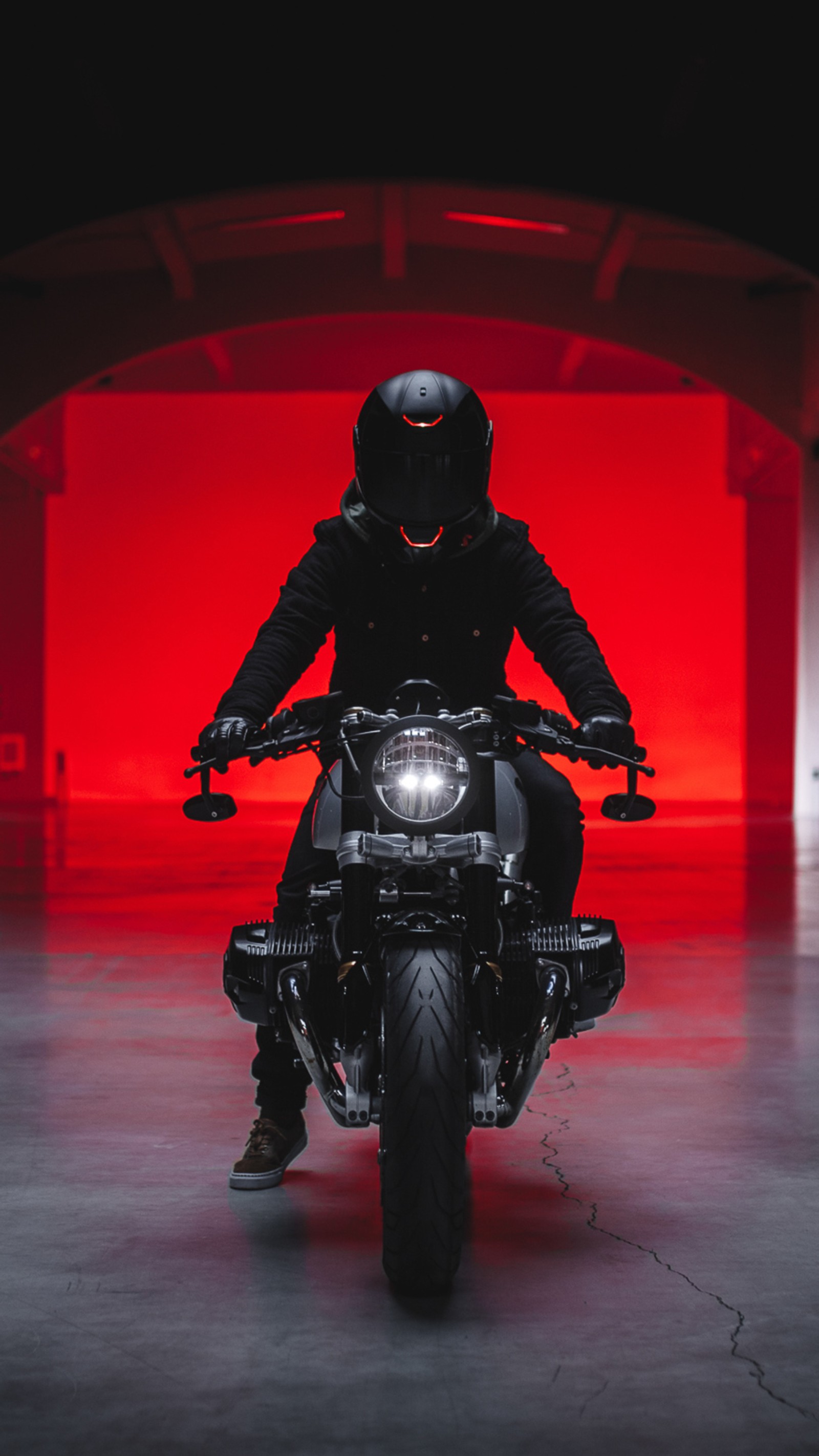 Arafed man in a black jacket riding a motorcycle in a garage (bmw r ninet, motorcycle, custom motorcycle, tire, wheel)